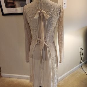 A'Reve lace, cream sweater with ties in back. Size small.